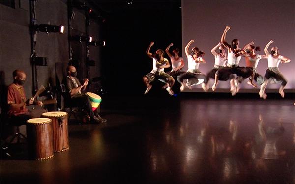 Drummers and dancers performing on stage