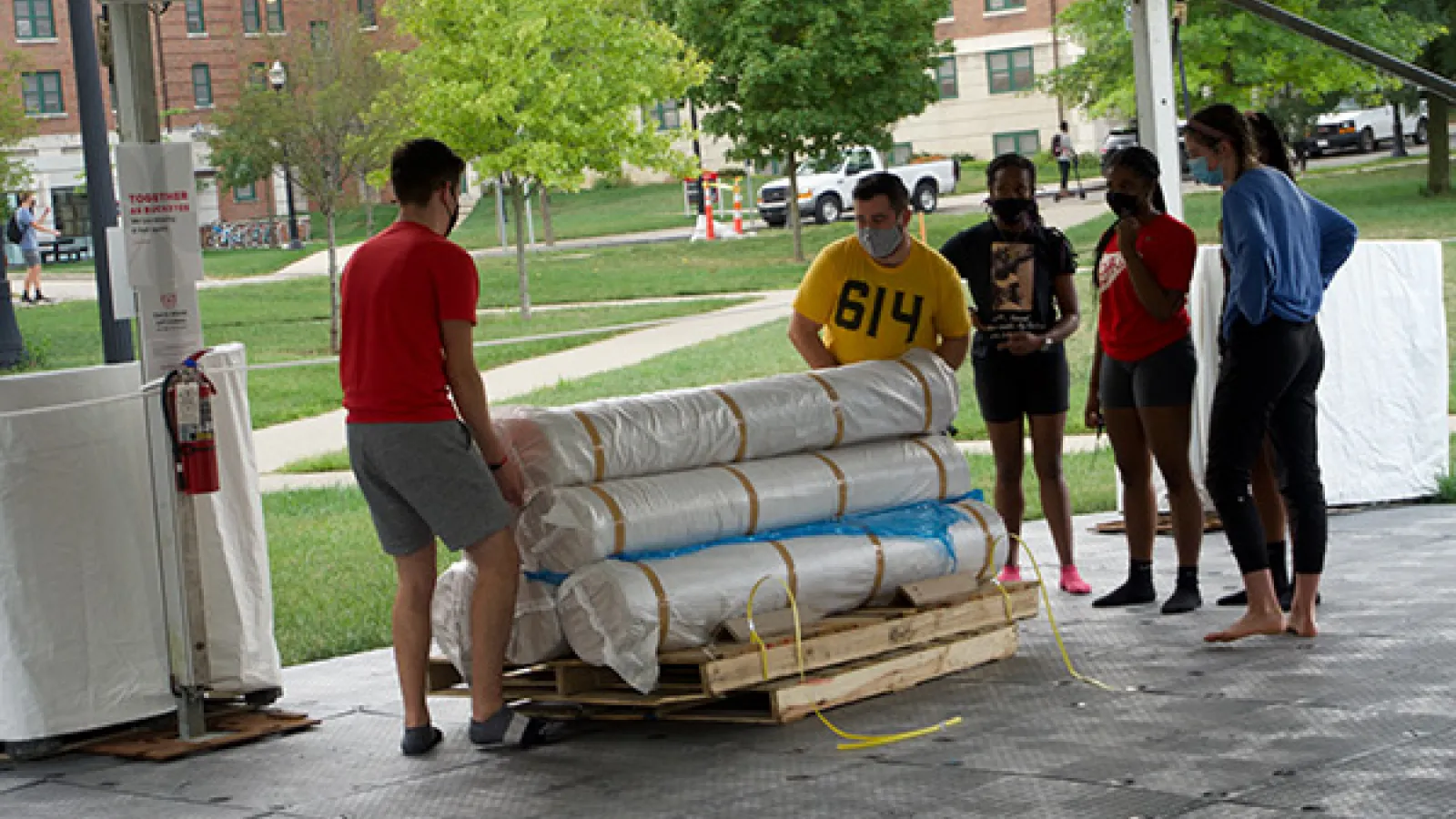 Jonathon Hunter (yellow t-shirt) and production students putting down the dance floor. 