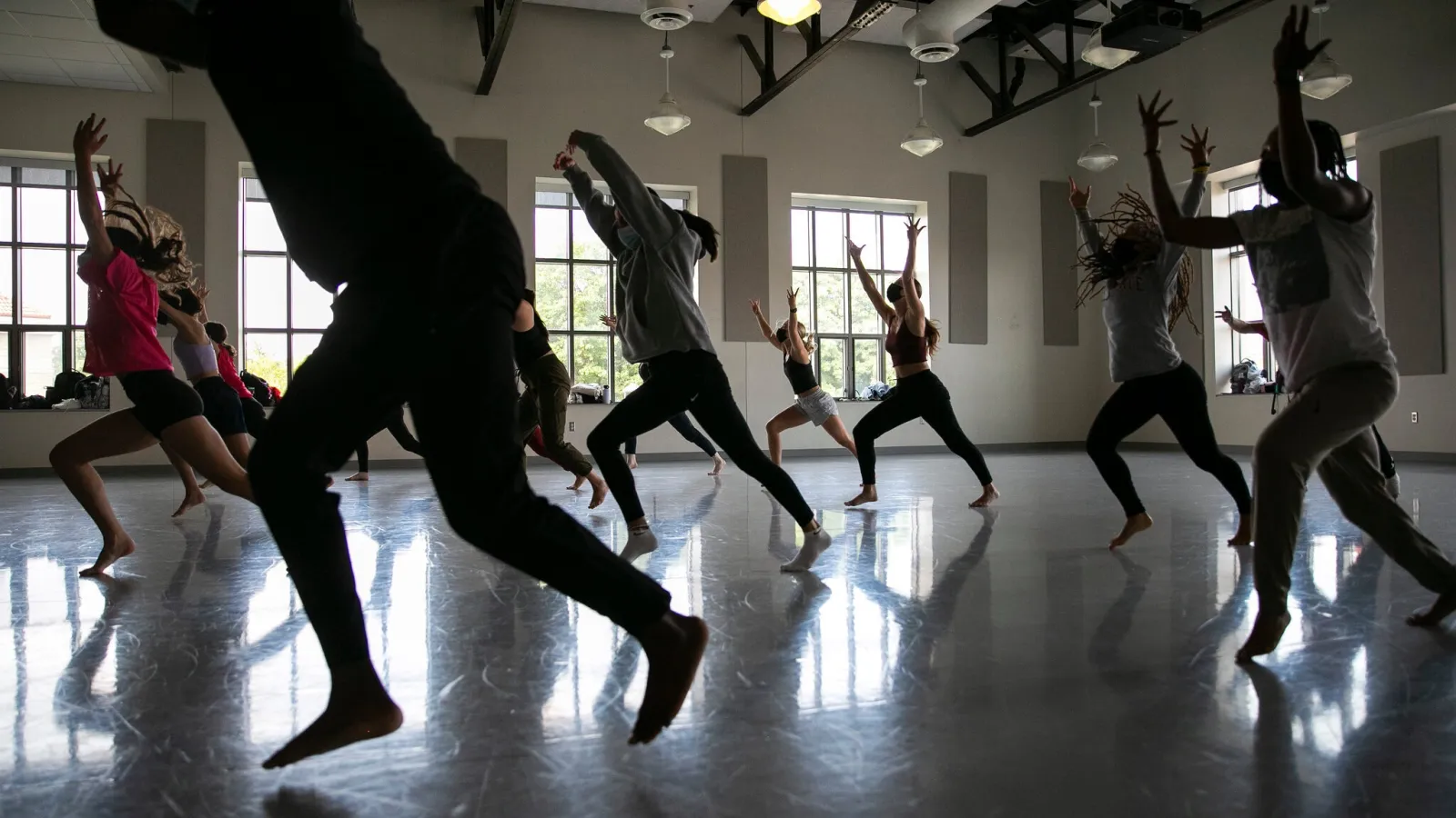 Dancers moving in a studio