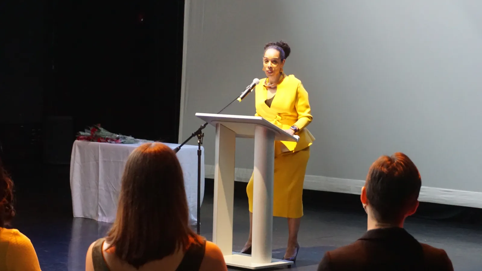 Speaker standing at a podium