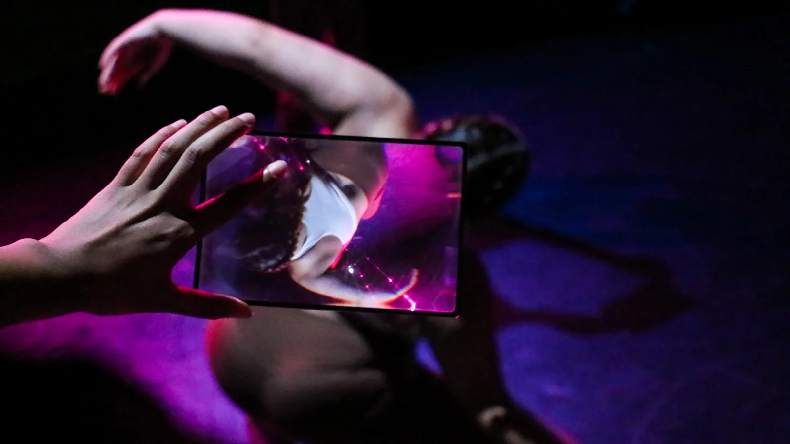 dancer performing and recorded on handheld device