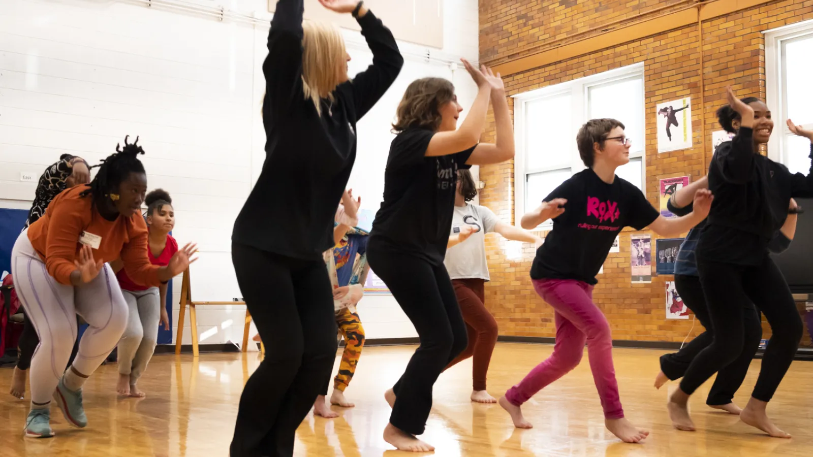 Students dancing in a gymnasium