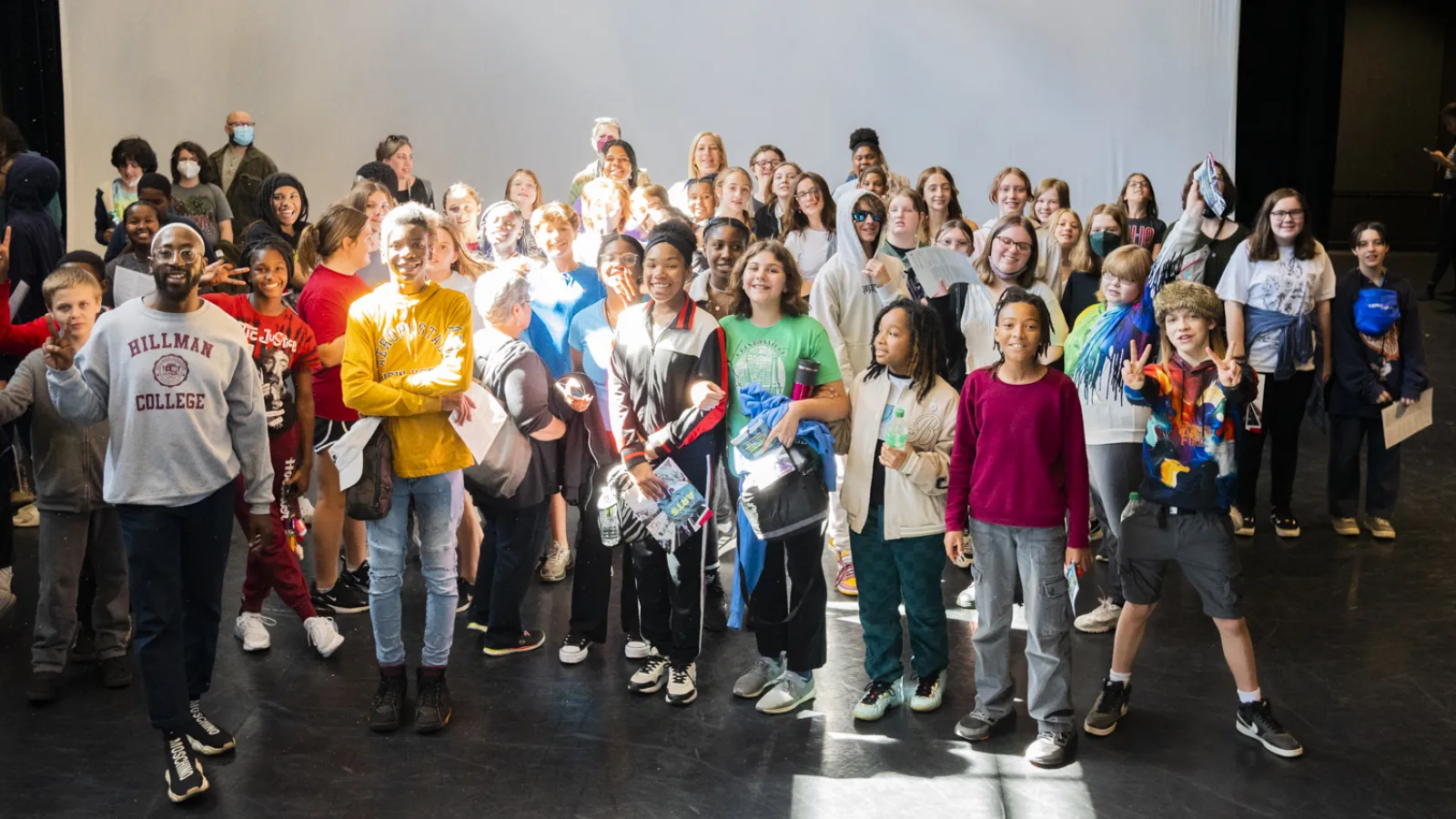 Students rehearsing on stage