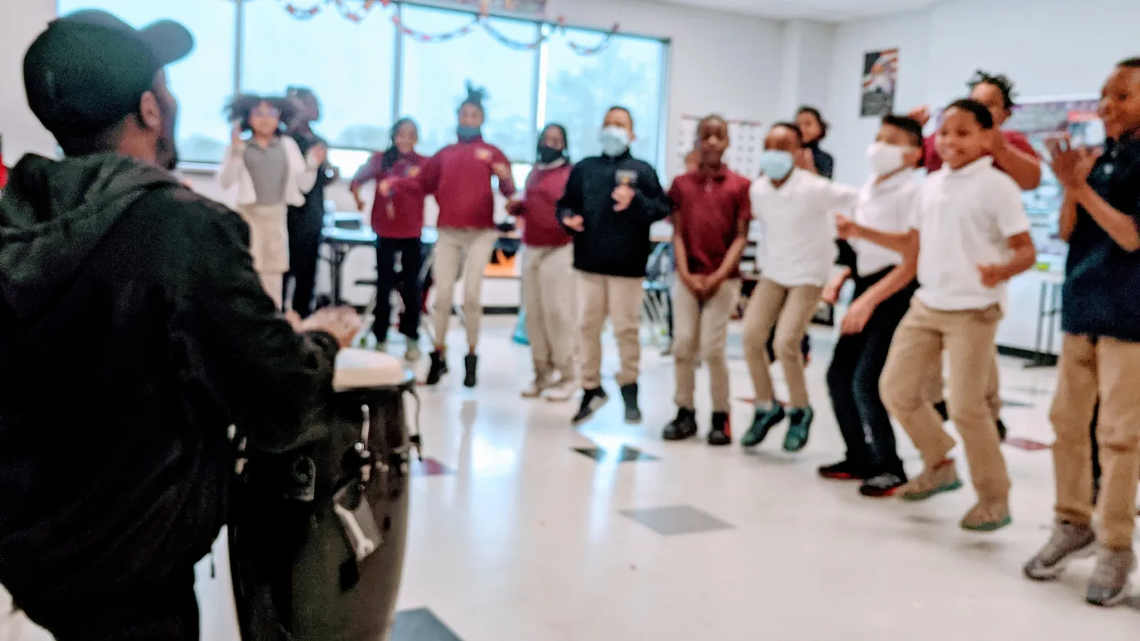 Drummer playing for elementary students