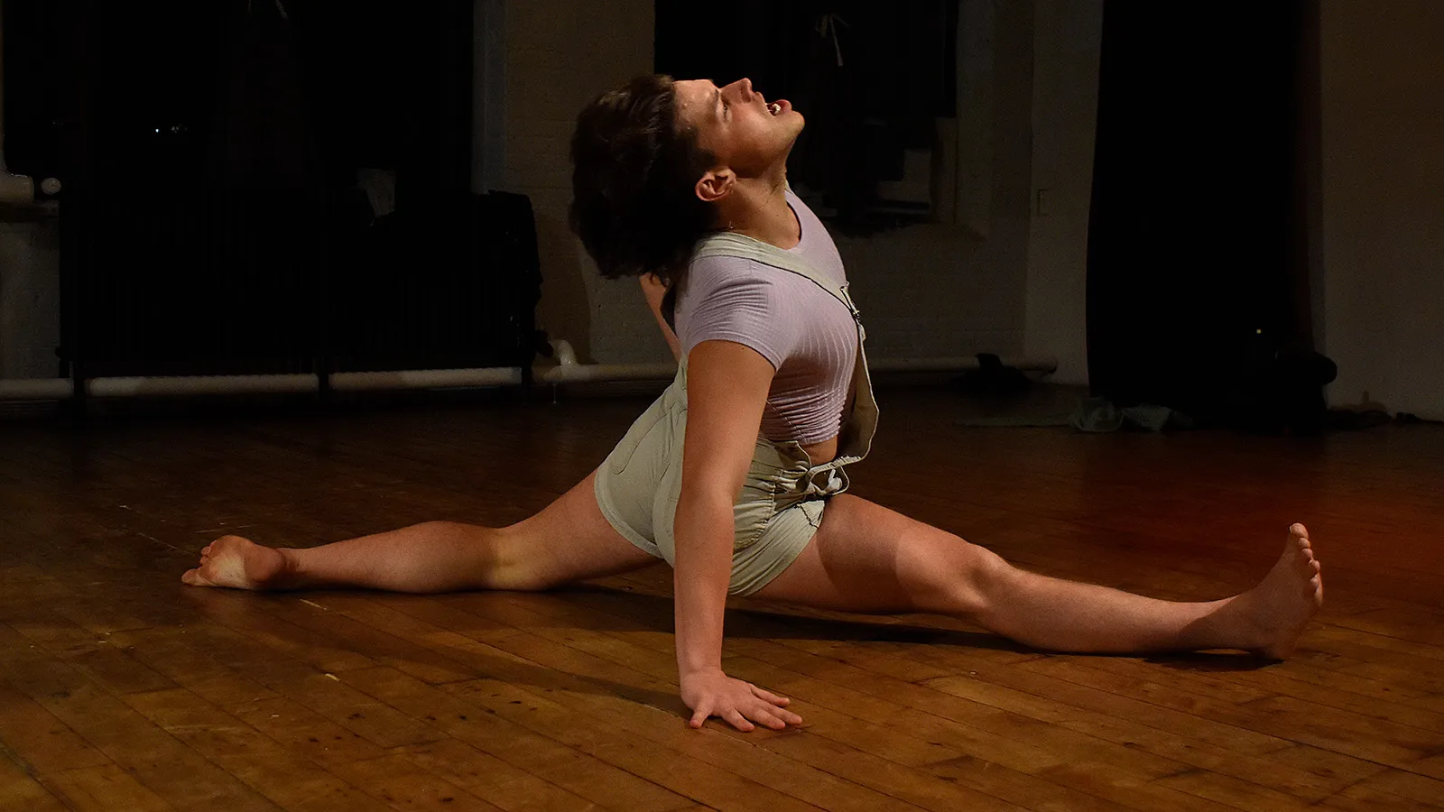 person with legs stretched on floor