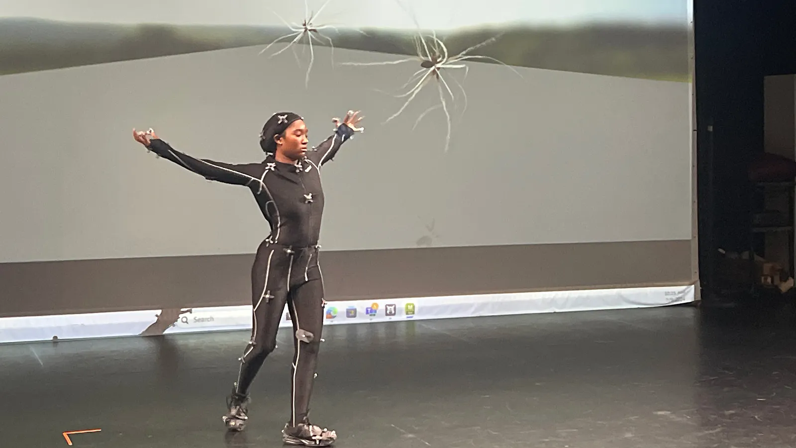 Dancers in motion capture suits rehearsing
