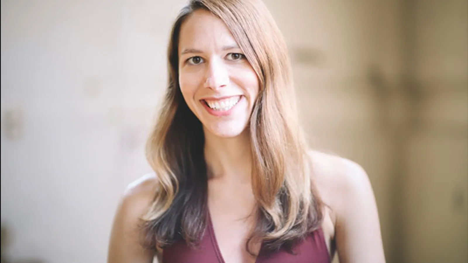 A person with long light and brown dark hair