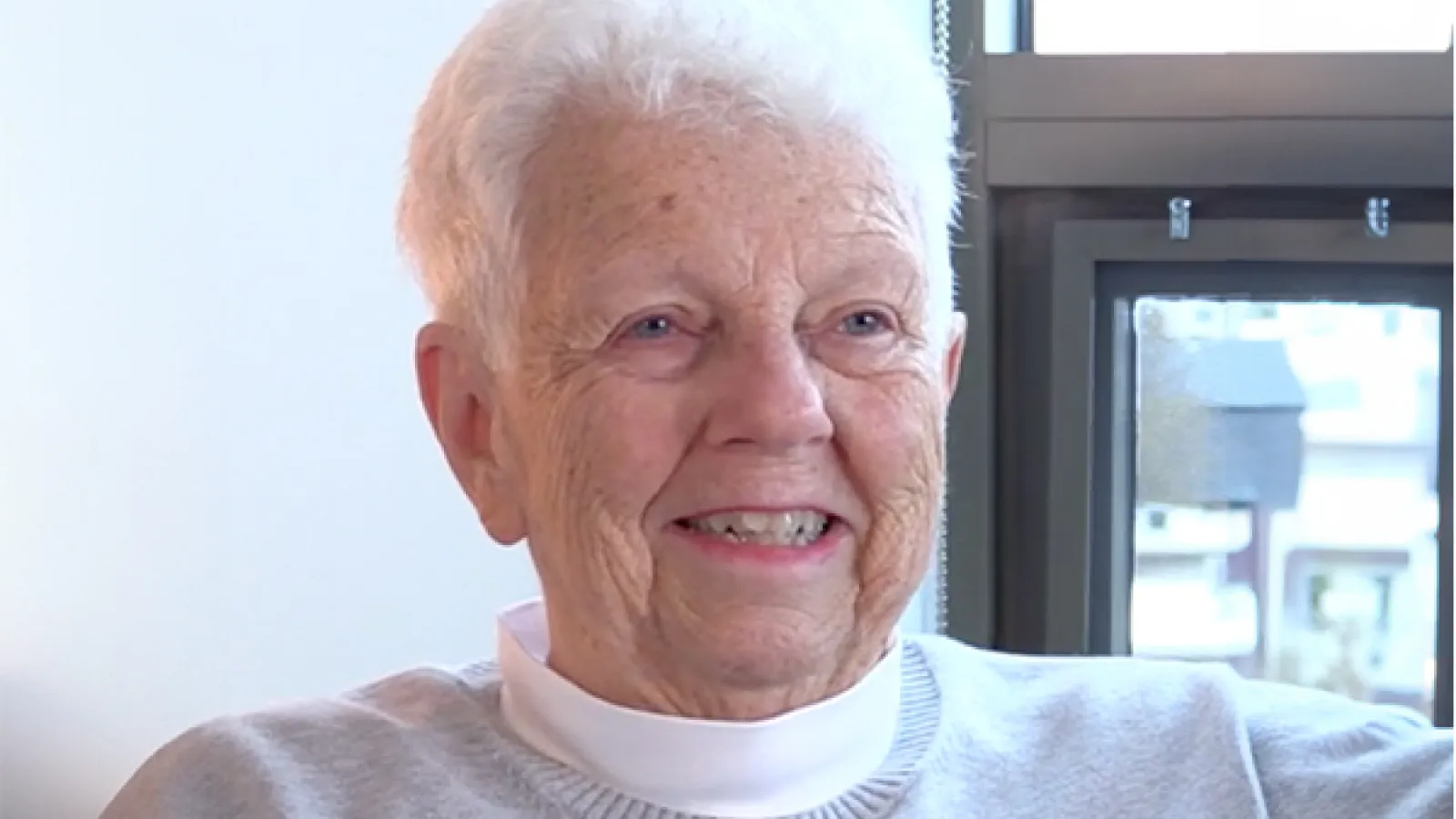 person with short white hair