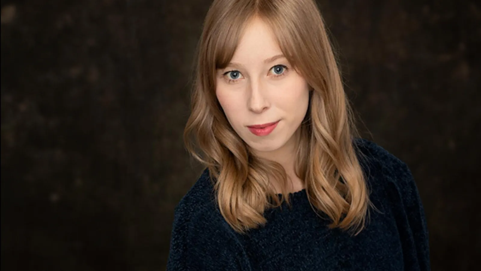 A person with long blonde hair