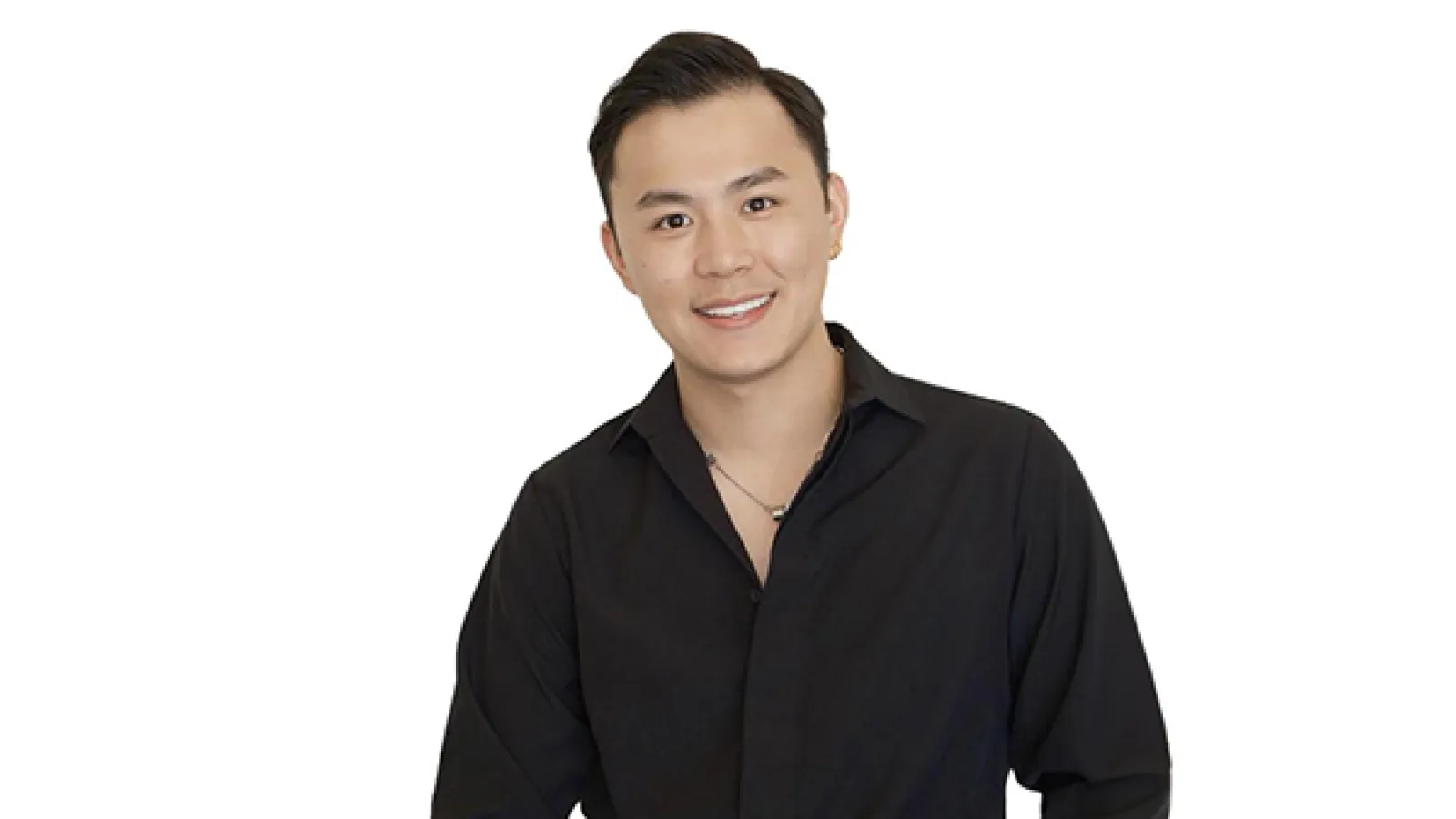 person with short black hair and black long sleeve shirt