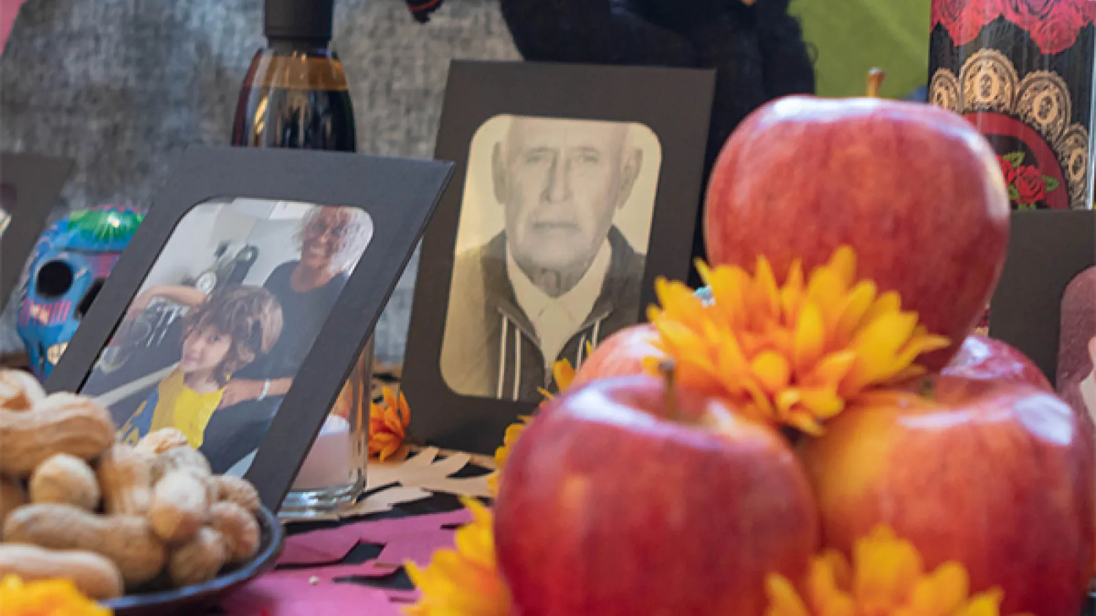 a table with photos, decorations and food