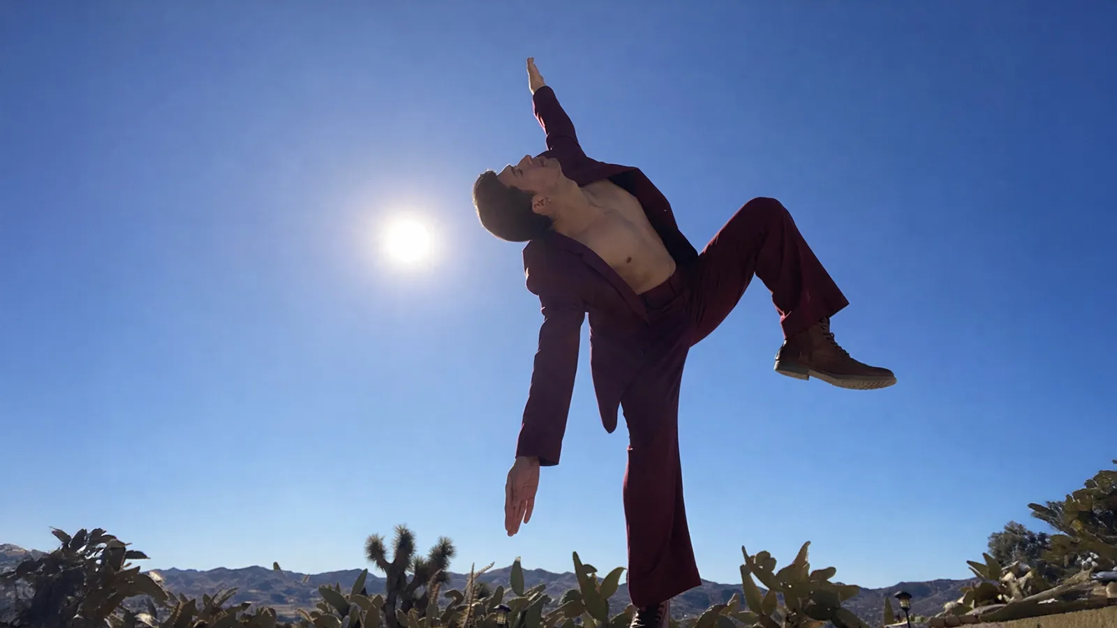 man dancing in a desert