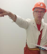 Susan Petry gives directions during renovation.