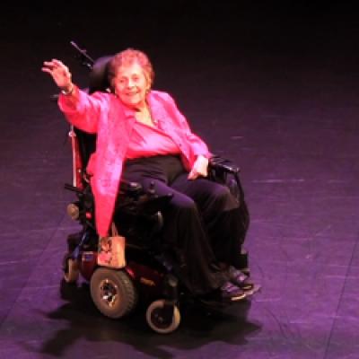 Helen Alkire waves to friends at her birthday.