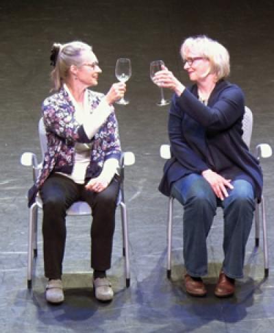 Melanie Bales and Candace Feck raise their glasses.