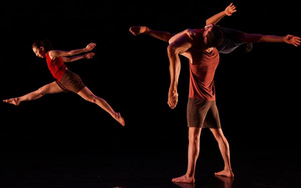 Dancers dancing with black background