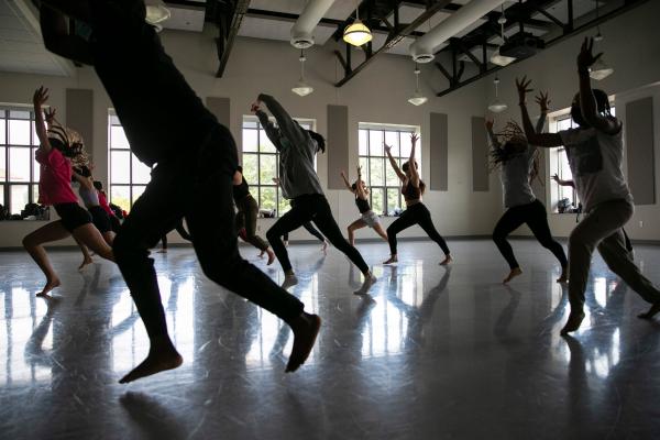 Dancers moving in a studio