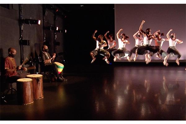 Drummers and dancers performing