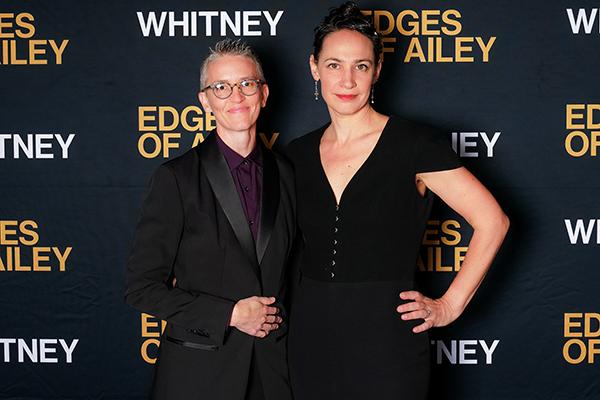 Two people standing together
