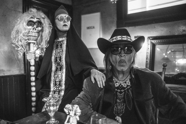 two people dressed in black