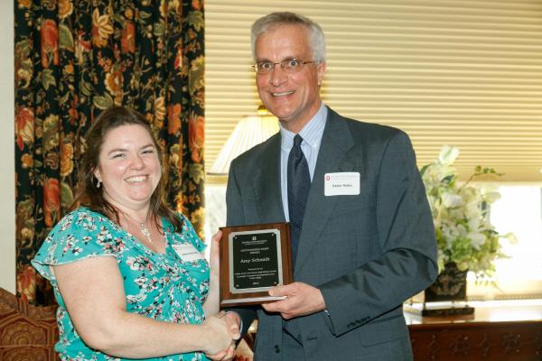 Amy Schmidt receives the ASC Outstanding Staff Award from Peter Hahn. 