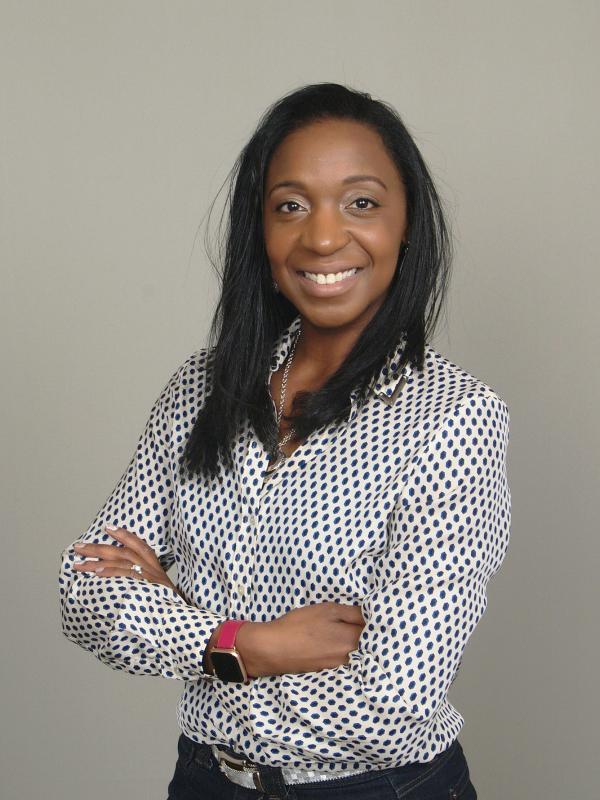 Woman smiling with arms crossed 