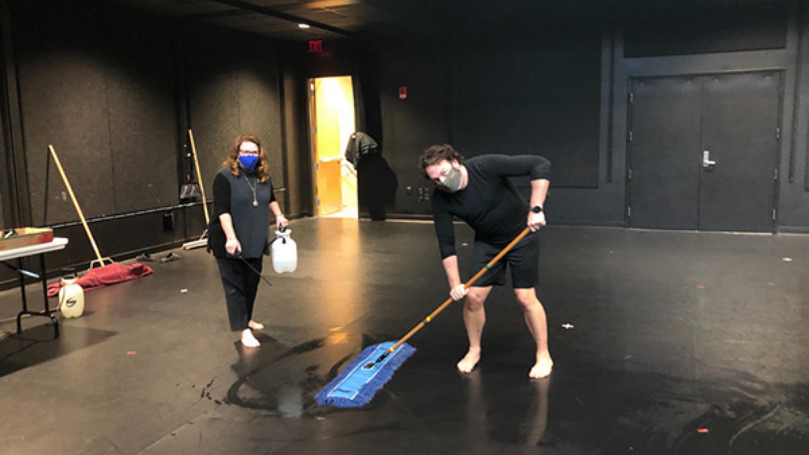 Dance faculty cleaning theatre