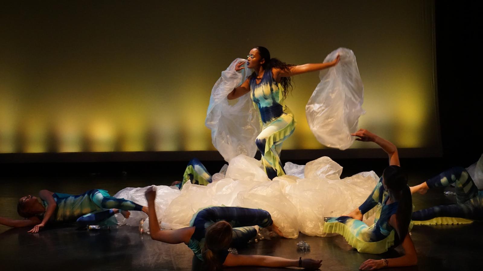 Dancers performing with plastic bags