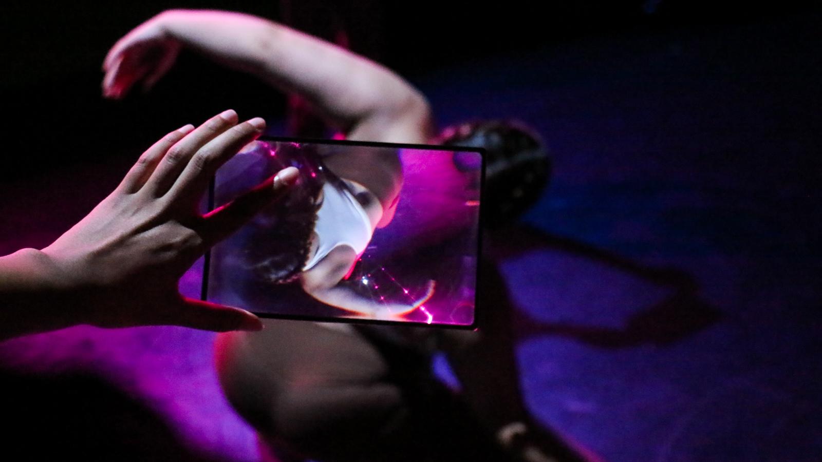 dancer performing and recorded on handheld device