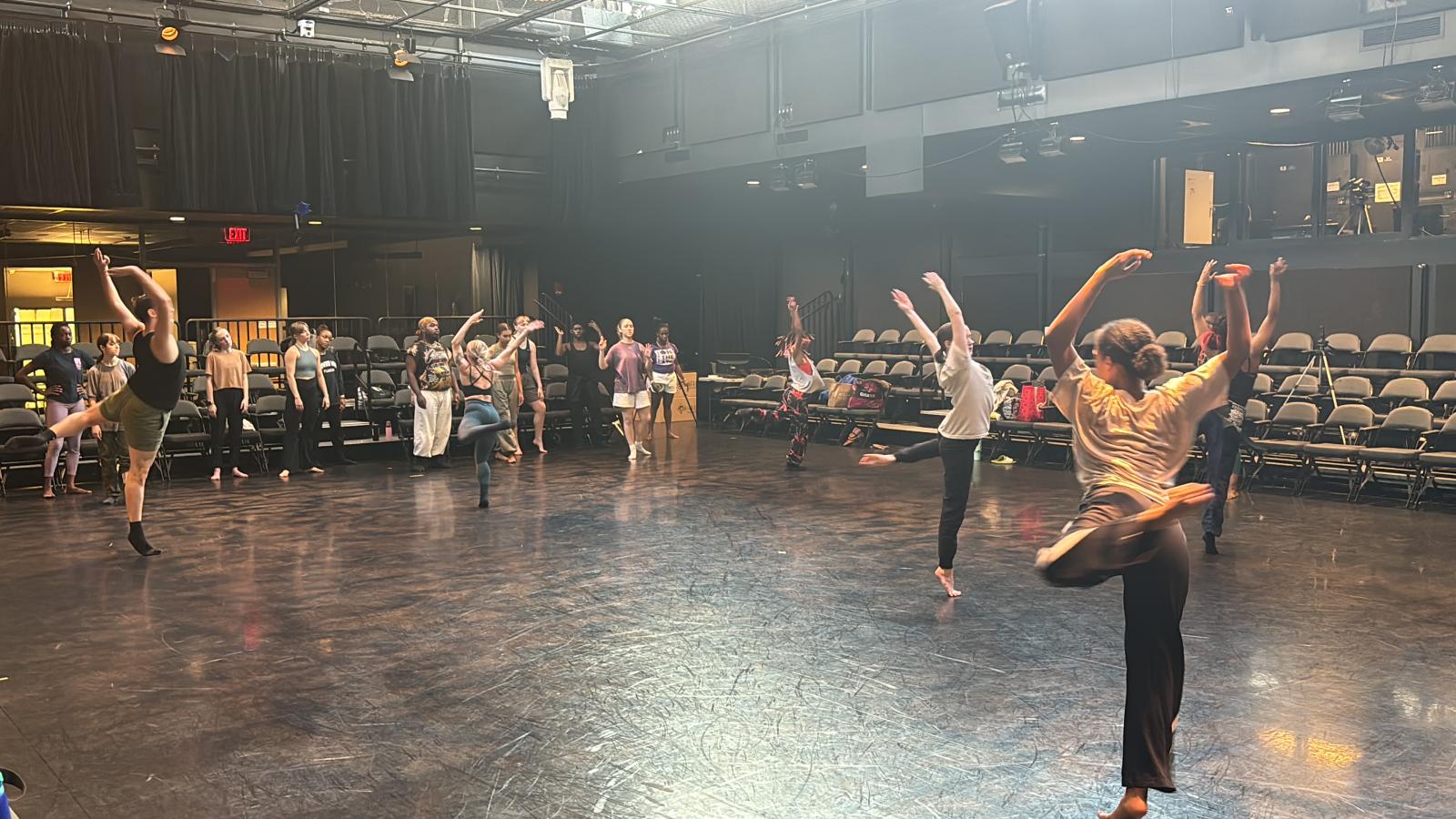 Dancers rehearsing in a theatre