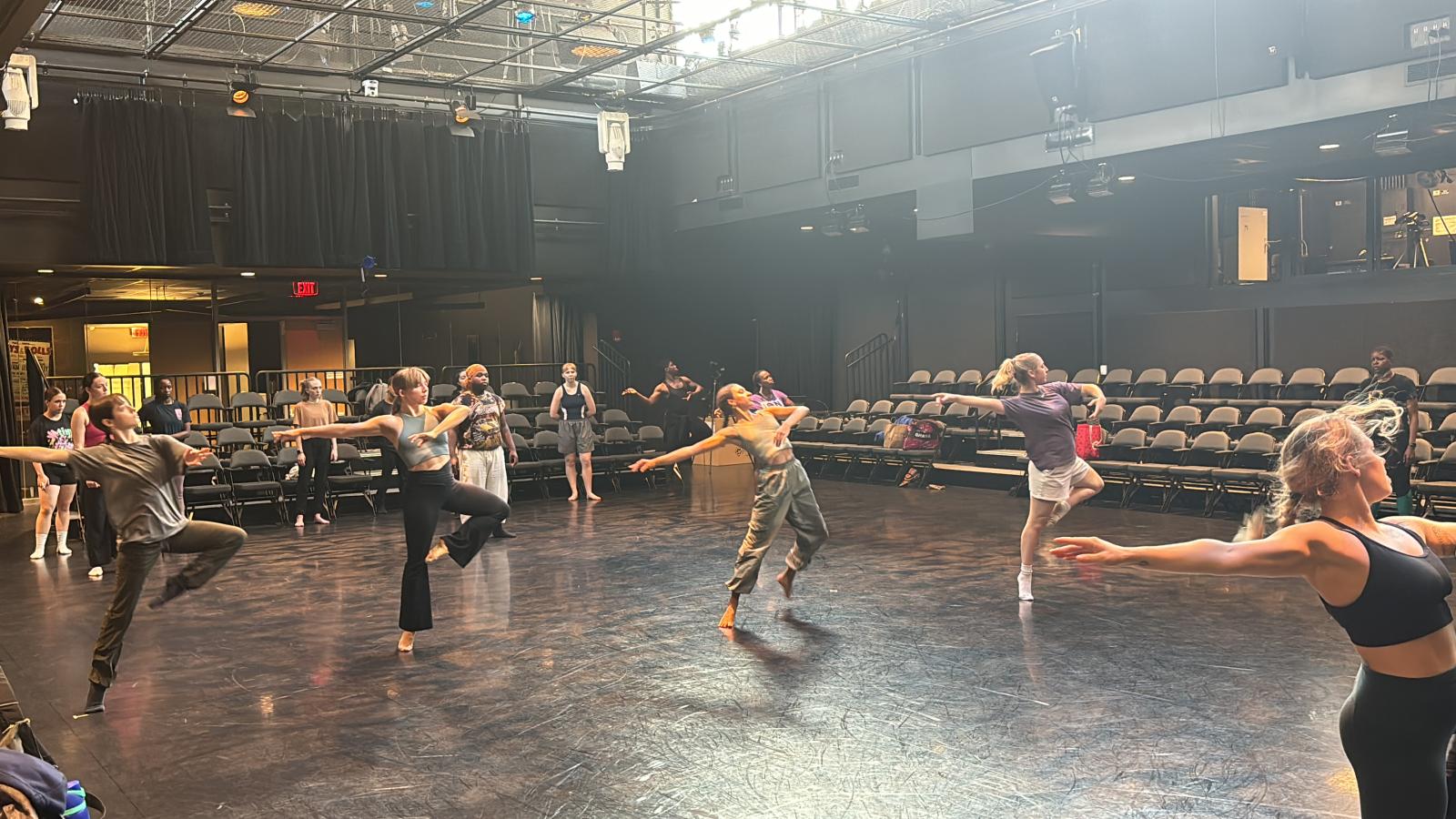 Dancers rehearsing in a theatre