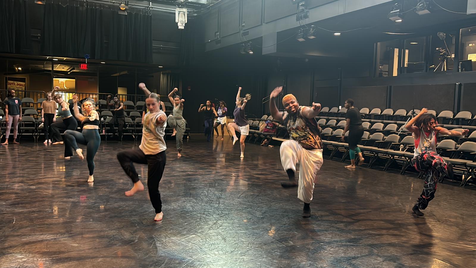 Dancers rehearsing in a theatre