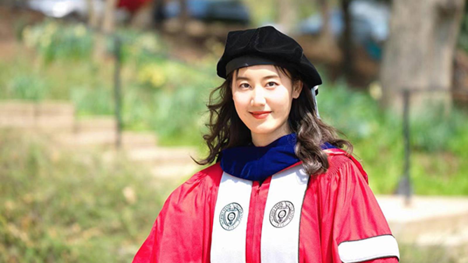 Person in red graduation gown 