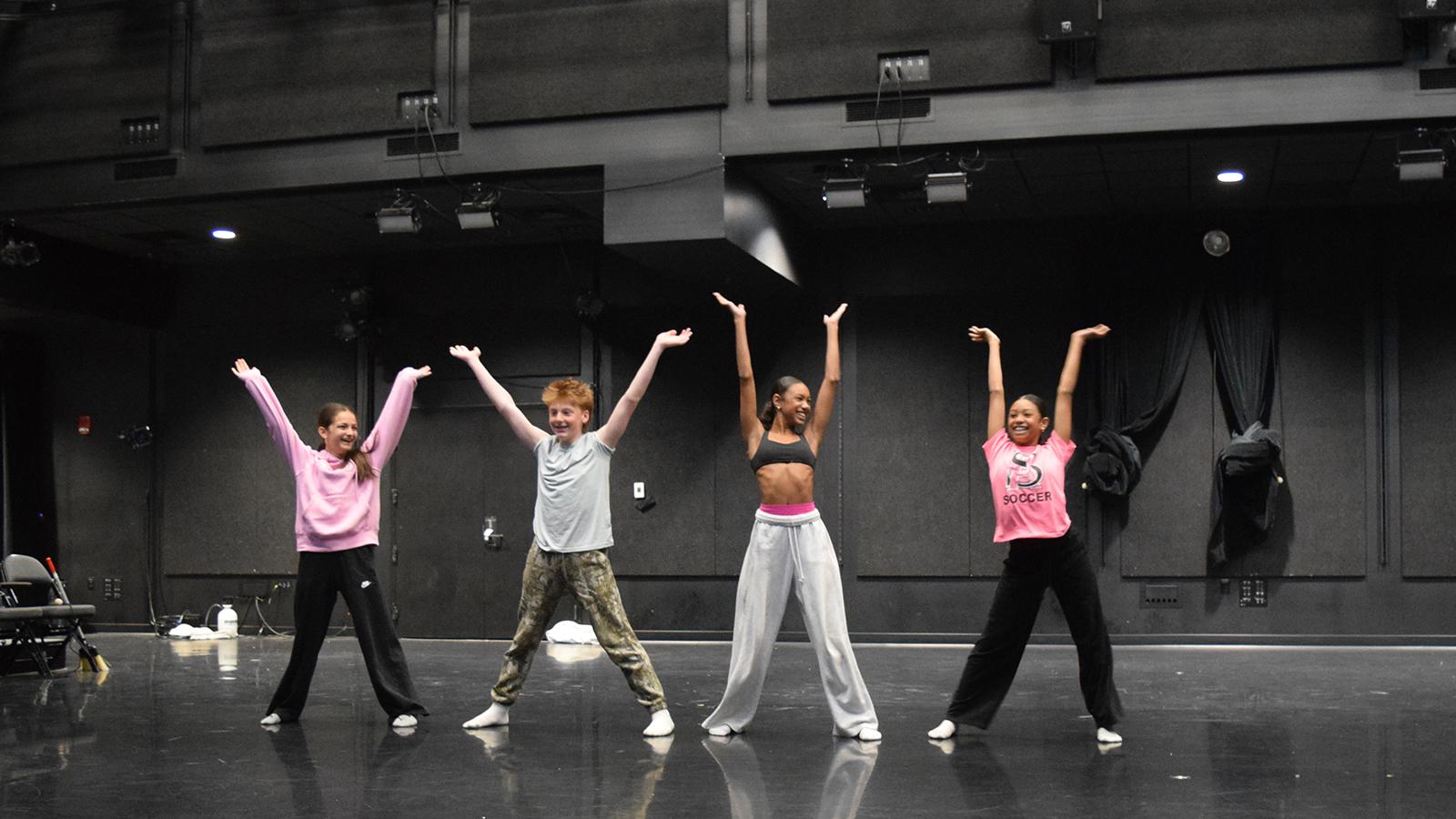 Dancers rehearsing on a stage
