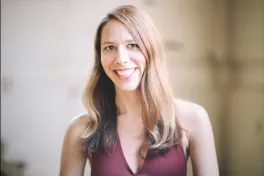 A person with long light and brown dark hair