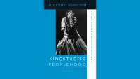 Blue book cover with black and white photo of a dancer performing