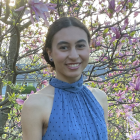 Person standing in front of flowering tree