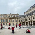 Dancers performing in front of building